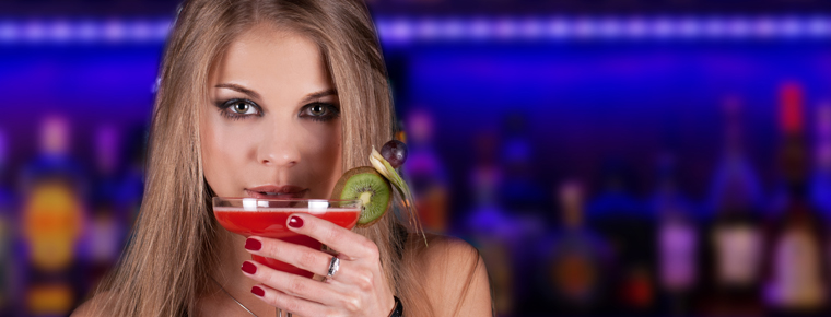 Beautiful girl drinking a cocktail
